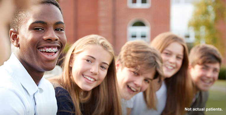 Five teens smiling